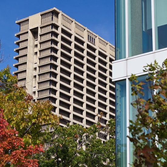 University Hall with autumn trees and the edge of Grant Hall